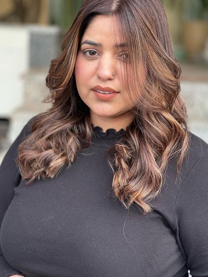 A final portrait of the cool brown balayage. This shot captures the overall sophisticated feel of the color and style, perfect for someone wanting a chic and modern update.