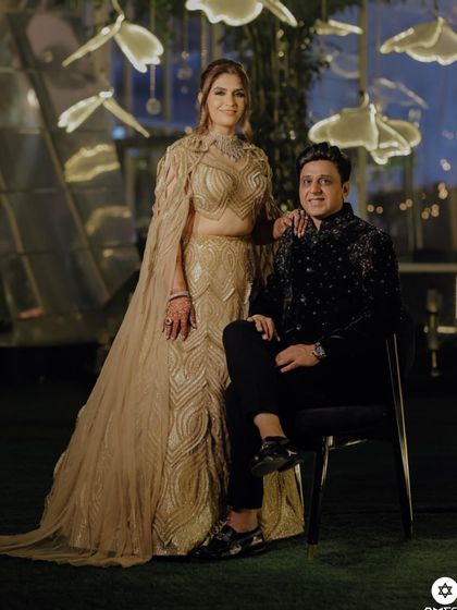 A client celebrating her 25th anniversary in a champagne gold, fully embellished lehenga. The look, crafted with my signature embroidery, blends tradition with timeless luxury.