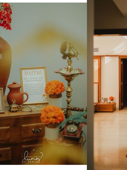 A close-up of the name reveal corner, with a beautiful brass lamp and framed sign.