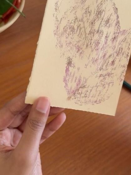 A close-up of the leaf print on an Indian postcard. The delicate details and natural pigment create a beautiful, rustic effect. It’s a perfect example of how we can use nature to add a personal touch to our communications.