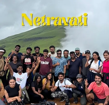 This is what a weekend reset looks like. A happy crew on the summit of Netravati Peak, surrounded by the rolling green hills of the Western Ghats. We handle the planning, you just show up and make memories.