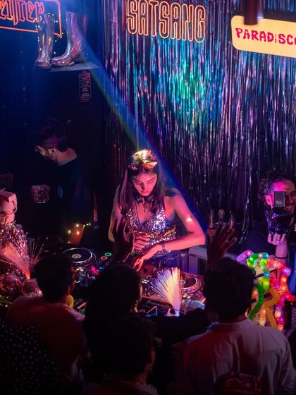Me in my element at ParaDisco x Satsang. We transformed the venue with iridescent backdrops, disco balls, and custom lighting to create a true disco paradise.