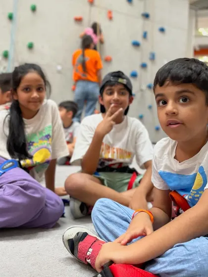 School's out, fun's in! A group of students taking a break between climbs, sharing stories and making friends during their day trip.