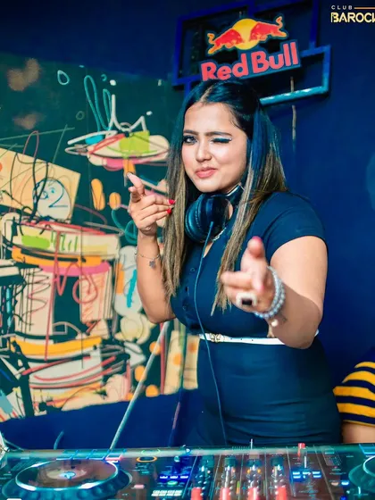 A quick wink to the crowd at Club Barocks. It's all about having fun and sharing that positive, high energy vibe from behind the console.