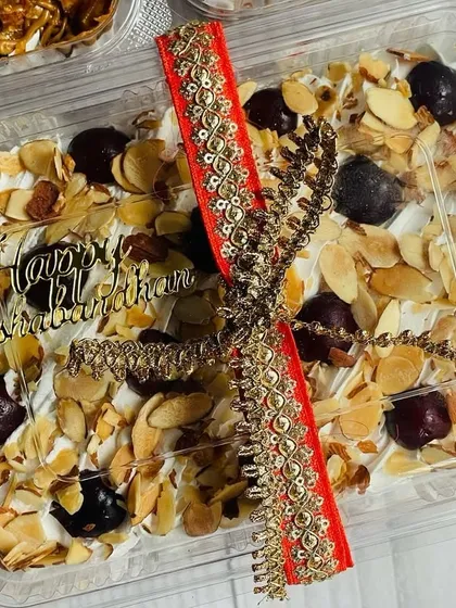 A close-up of my Cherry Almond Tres Leches tub, decorated for Rakhi. It’s a sweet and fruity delight, perfect for celebrating with your sibling.