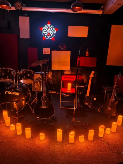 The stage is set. This is the calm before the storm of creativity at one of our candlelit open mics. We provide the mics, the sound system, and the vibe; you just need to bring your talent.