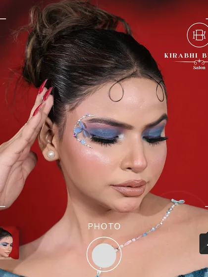 A dreamy and artistic look with a blue butterfly wing design on the eye. This kind of creative makeup is perfect for themed photoshoots or fantasy-inspired events.