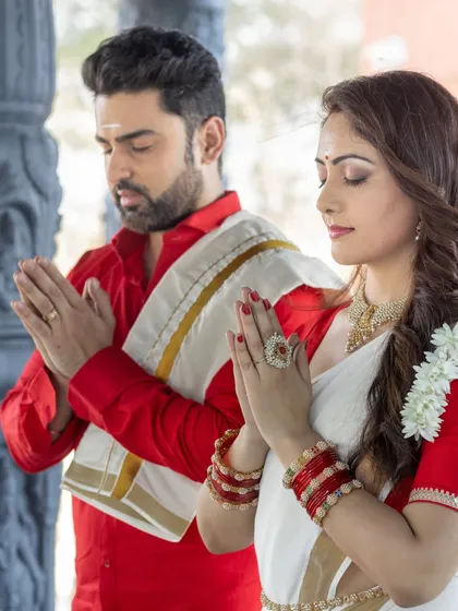 A moment of prayer and togetherness. This beautiful shot captures the serene and spiritual side of a couple's journey.