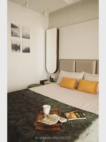 A minimalist master bedroom with clean lines and a focus on natural light. The four-piece art set adds a personal touch without overwhelming the serene design.