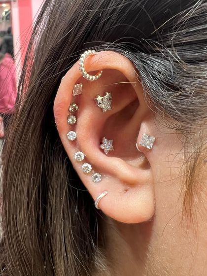 Another look at this popular mixed-metal stack, showing how different textures and shapes can work together to create a unique and personalized ear story.