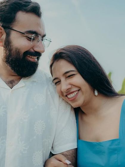 A sweet, candid moment of her resting her head on his shoulder. These simple gestures of affection are what make a couple shoot feel so personal and real.