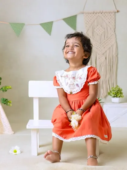 My boho-themed sessions use natural textures like macrame, wood, and greenery to create a calm and earthy setting that beautifully complements your child's simple joy.