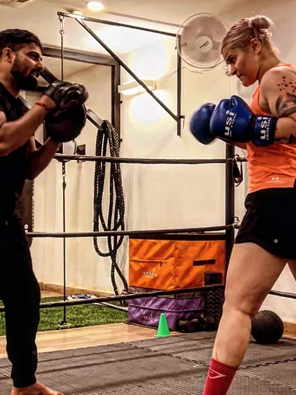 In the ring, it's just you, me, and the goal. I focus on every detail of your form, making sure each punch you throw is stronger and sharper than the last. This is one-on-one coaching at its most intense.