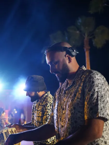A candid shot of me and my DJ partner on the decks during a wedding in Marrakech. The energy between us is what fuels the party.
