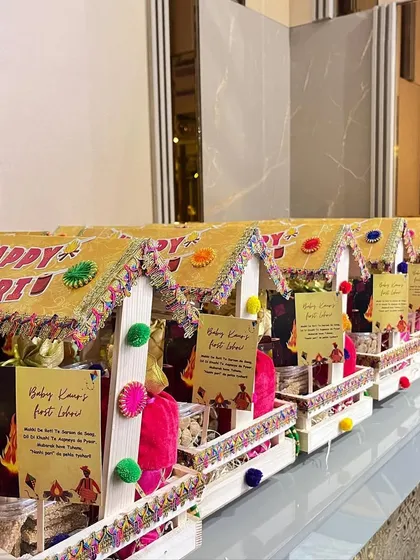 A row of the "Happy Lohri" party favors, ready to be given to guests.