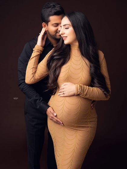 A tender moment captured. The way he gently touches her face is so full of love and care.
