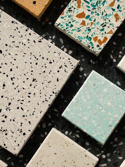 A close-up on a mix of terrazzo samples, highlighting the different textures, colors, and aggregate materials we work with.