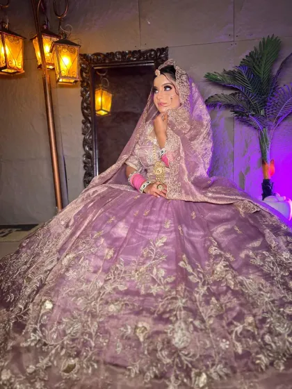 Another angle of the lilac lehenga, with the bride looking away, highlighting the dupatta draping.
