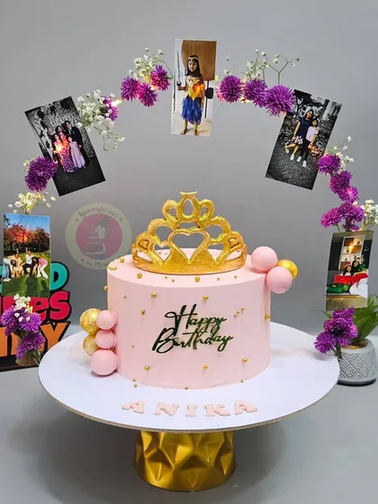 We love a creative challenge. This unique cake features a beautiful arch decorated with the birthday girl's personal photos, creating a truly personalized and memorable centerpiece.