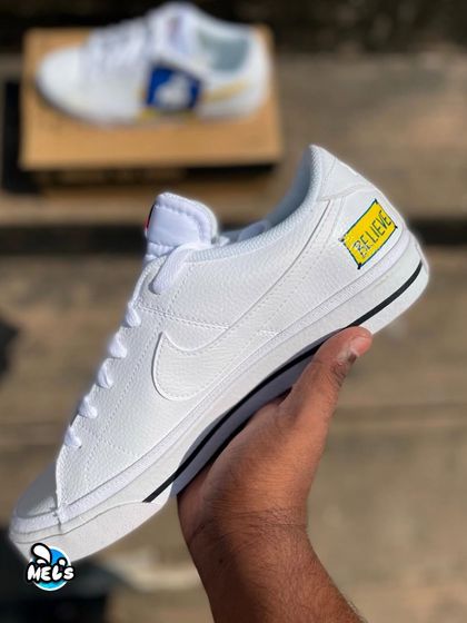 A full view of the "BELIEVE" side of the Ted Lasso inspired custom sneaker.