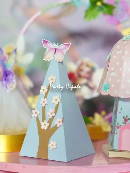 I love creating tiny, detailed props that add to the magic. These miniature fairy houses and butterfly-topped cones were part of the delicate tablescape for an enchanted birthday.