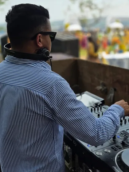 A shot from behind the console during a Mehndi brunch in Goa. You can see the guests in their colorful attire enjoying the daytime festivities.
