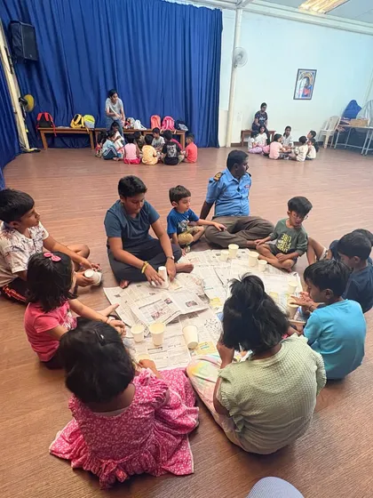This wider shot shows multiple groups of children working on their crafts in our spacious studio. It highlights the community feel of our classes, where students of different ages can create side-by-side.