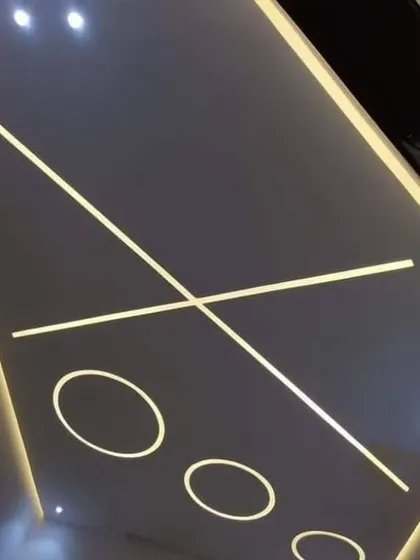 A fun and modern design using profile lighting to create a "tic-tac-toe" board effect. This is a playful yet stylish choice for a game room or creative space.