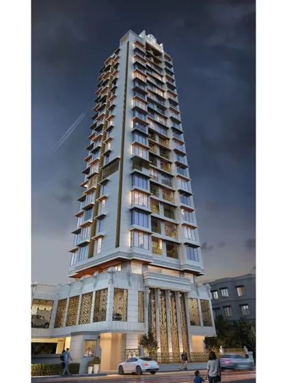 A night-time rendering of the Mumbai residential tower, emphasizing the intricate lighting design. The illuminated entrance and facade details create a dramatic and welcoming presence after dark.