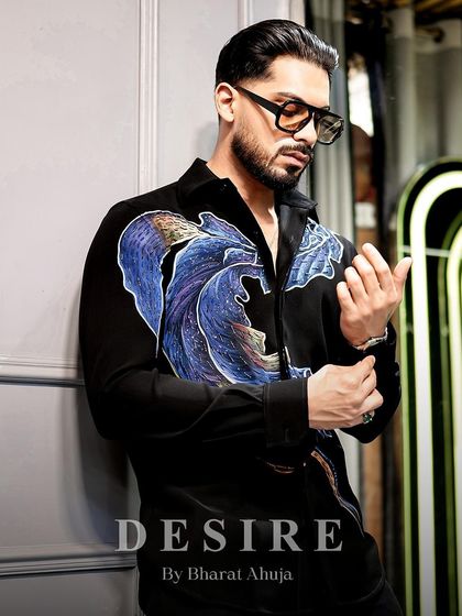 A closer look at the abstract wave shirt, showing the intricate details and the confident posture it inspires.