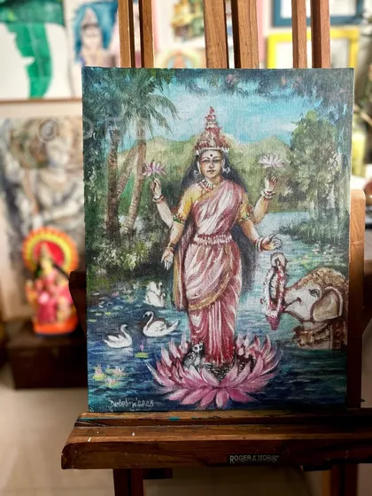 My completed painting of Goddess Varalakshmi, displayed on an easel in my studio. This piece was created to celebrate the auspicious festival of Varamahalakshmi Pooja.