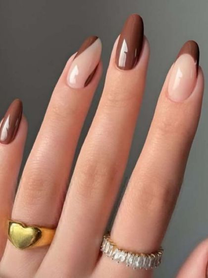A modern design with a brown color-block and French tip combination.
