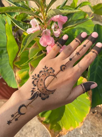 The same Ramadan design, photographed outdoors among green leaves.