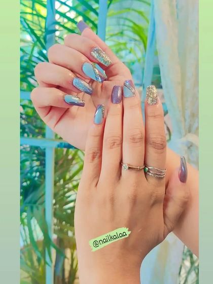 A sophisticated mix of solid dusty purple and a shimmering blue-grey, accented with silver glitter lines.