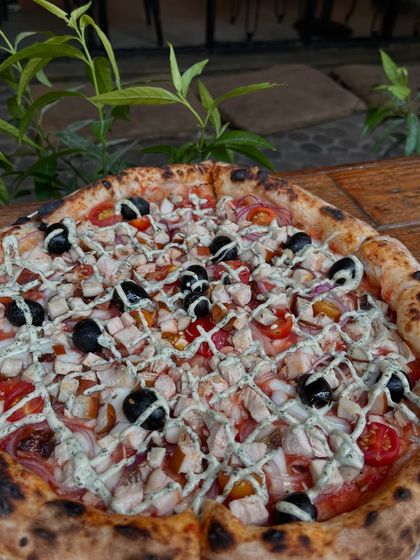 No drama, just pizza. Our smoked chicken pizza is here to make your day better.