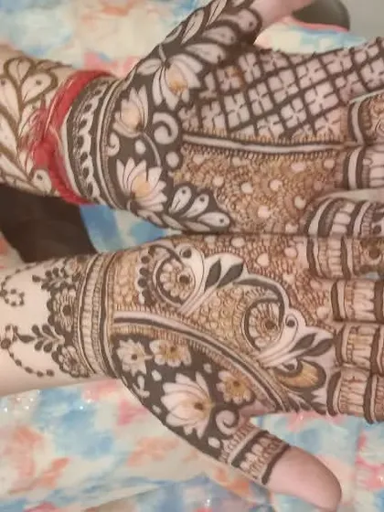 A beautiful example of a shaded Arabic mehndi design. The use of light and dark henna creates a lovely depth, perfect for any festive occasion.