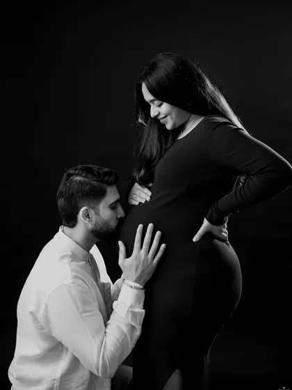 A classic black and white portrait showing a tender moment between the parents-to-be. Monochrome photos have a timeless quality that focuses purely on emotion and connection.