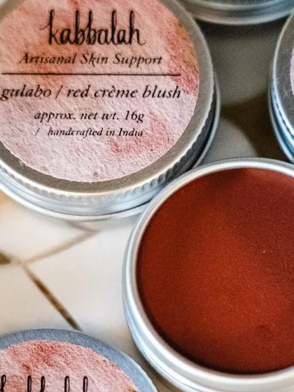 A close-up of my 'Gulabo' red crème blush. I use natural clays to achieve this beautiful, rich color. It’s a versatile tint for lips and cheeks that gives you a healthy, natural flush.