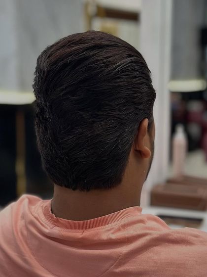 The back of a classic men's haircut. The lines are clean, and the hair is expertly tapered for a sharp finish.