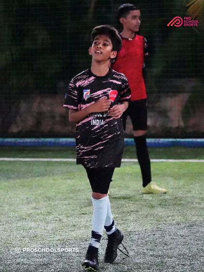 A player looks up to scan the field during a drill, developing their game awareness.