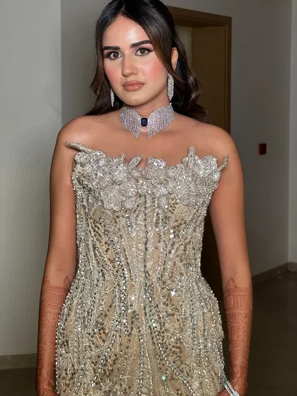 Another shot of this stunning red carpet-worthy look. The makeup enhances her features without overpowering the magnificent dress.