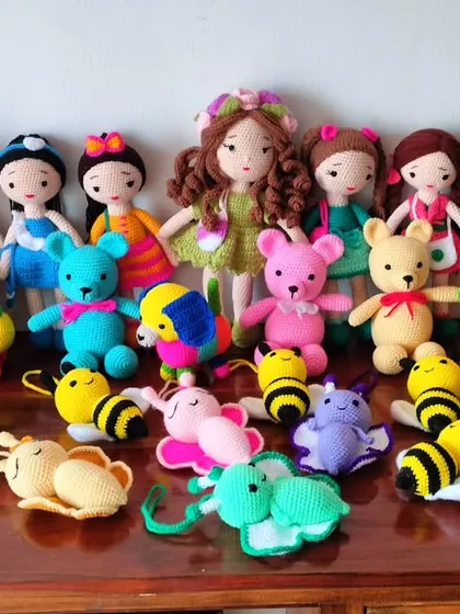 A whole collection of my dolls and mini toys, including teddy bears, bees, and butterflies.