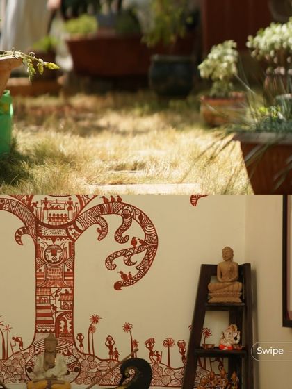 A detail of the interior decor in the Manjunath Residence, showing a traditional Warli painting on the wall, reflecting the homeowners' appreciation for Indian folk art.