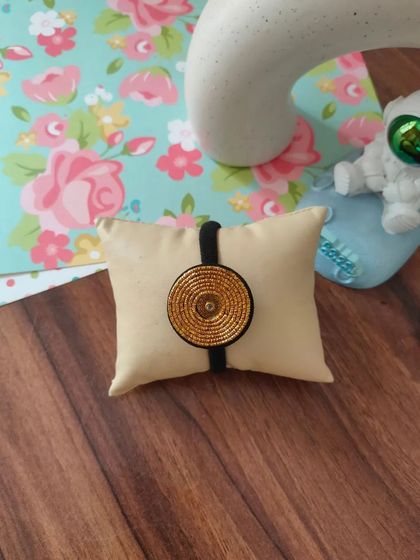 My collection of decorative elastic hair bands. Each one features a unique handmade centerpiece, including gotapatti, Kundan work, zardozi, and bead embroidery.