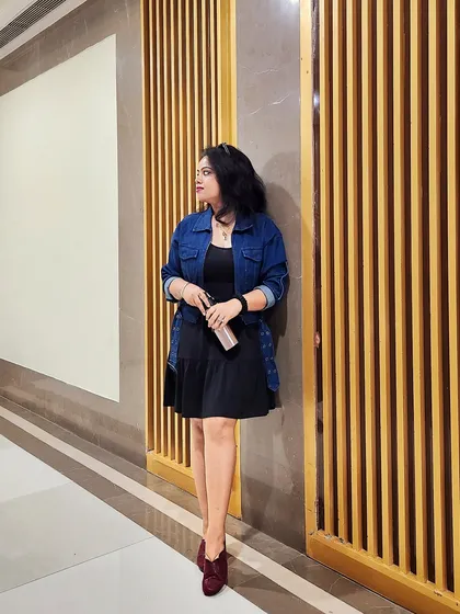 A simple black dress layered with a denim jacket is the ultimate casual chic look. It's versatile, comfortable, and always in style.
