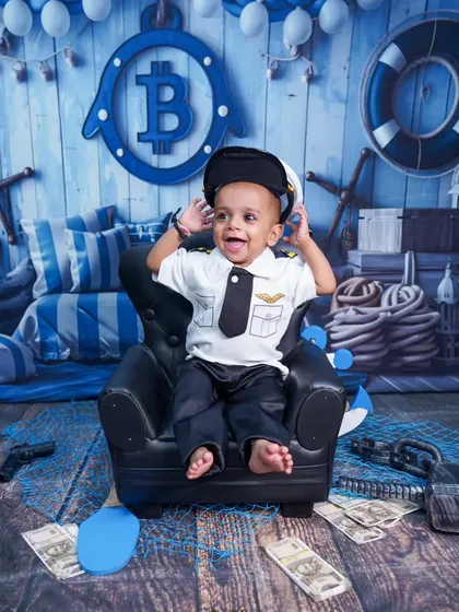 This little pilot is ready for takeoff in a fun variation of our Boss Baby theme, complete with a pilot's hat and a big smile.