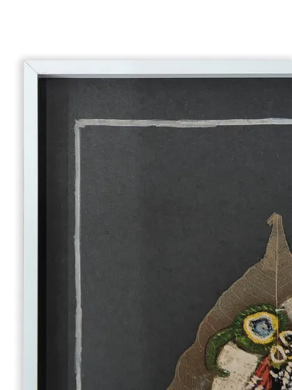 Another detail shot of the framed leaf painting, showing the texture of the leaf against the smooth mat board. Our framing techniques ensure such delicate items are securely mounted and protected.