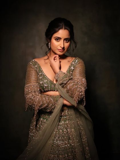 A beautiful portrait that highlights the delicate details of the blouse and the soft, elegant makeup.