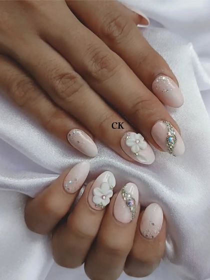 Another look at this elegant nude bridal design, showing the detail in the hand-sculpted flowers.