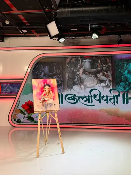 The completed "Bal Ganesh" watercolour painting displayed on an easel in the Saam TV studio.